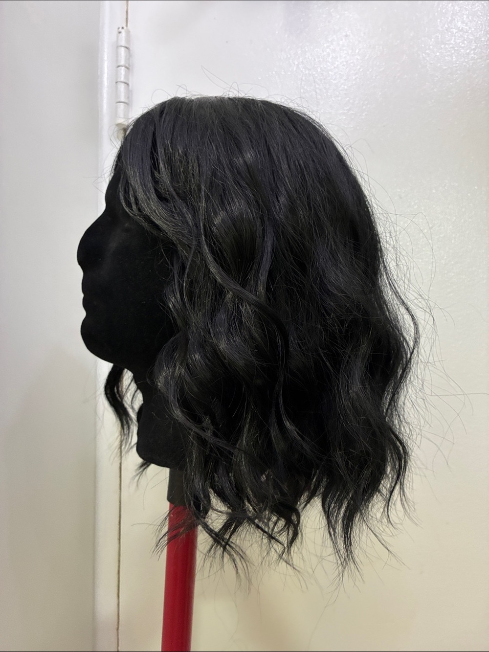 Short black synthetic wig 12”
